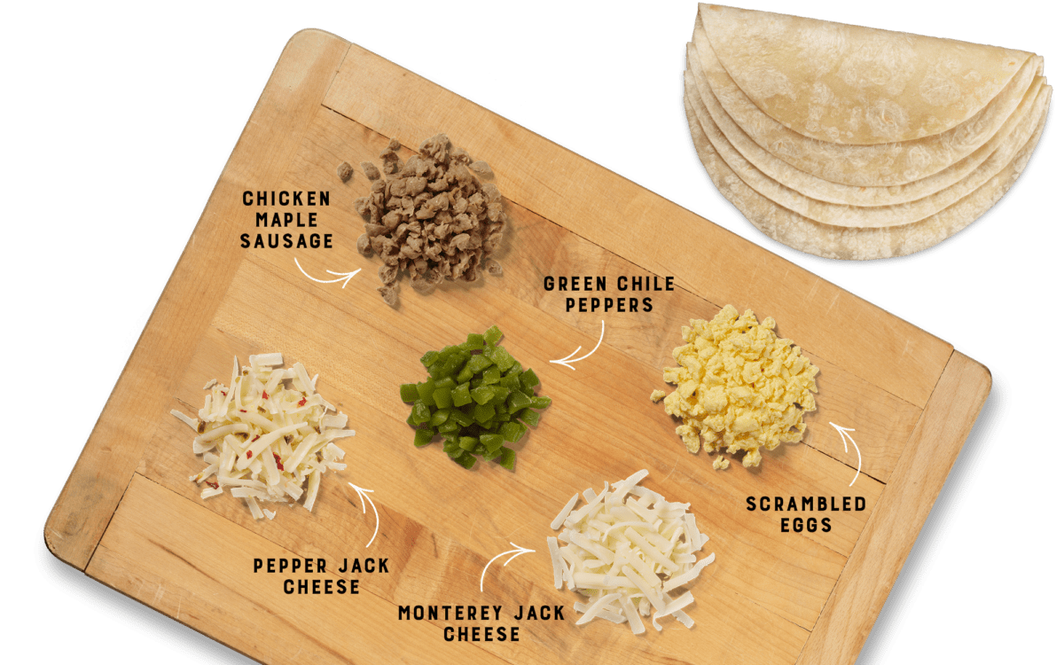 Chicken Maple Sausage Breakfast Burrito ingredients on Cutting Board